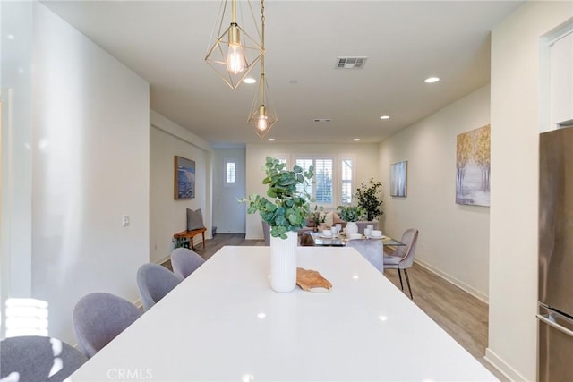 dining room with light hardwood / wood-style flooring