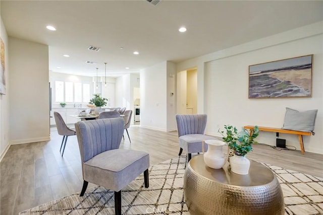 living room with light hardwood / wood-style floors