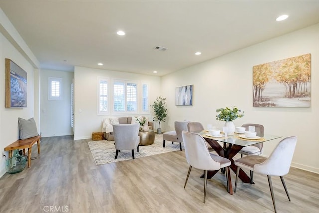 dining space featuring light hardwood / wood-style flooring