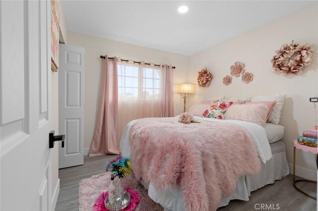 bedroom featuring light hardwood / wood-style flooring