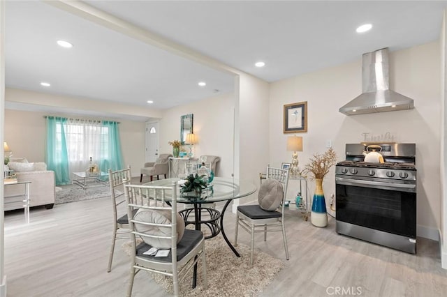 dining area with light hardwood / wood-style flooring