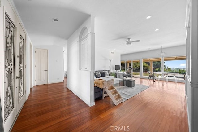 corridor featuring hardwood / wood-style floors and french doors