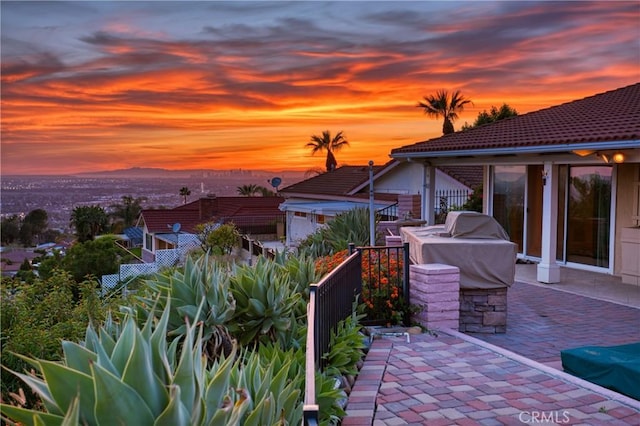 view of patio terrace at dusk