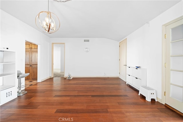 interior space with a chandelier and dark wood-type flooring