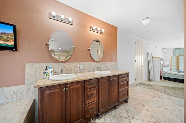 bathroom with tile patterned flooring and vanity