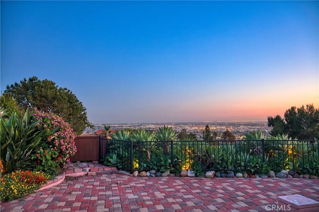 view of patio terrace at dusk