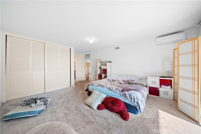 bedroom featuring carpet and a wall unit AC