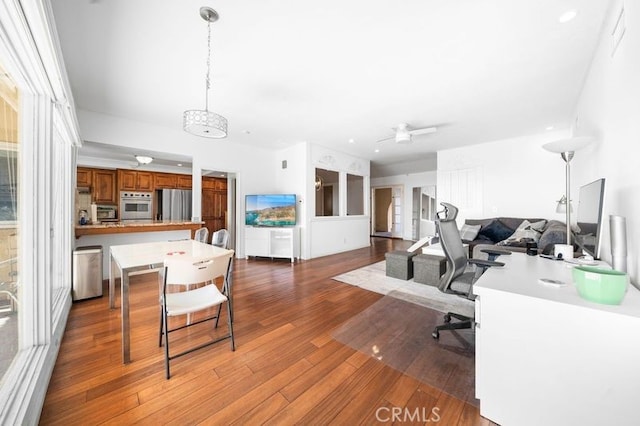 office space with hardwood / wood-style floors and ceiling fan