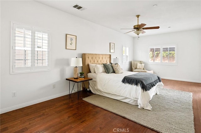 bedroom featuring dark hardwood / wood-style floors and ceiling fan