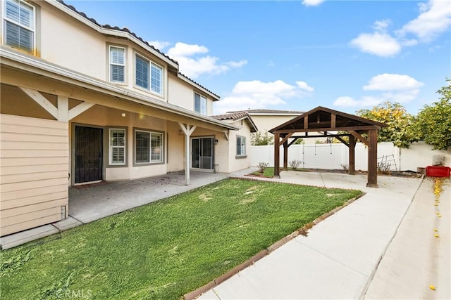 view of yard with a gazebo, a patio, and fence