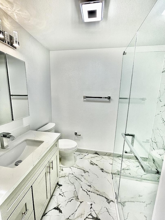 bathroom featuring vanity, a shower, toilet, and a textured ceiling