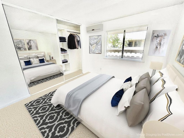 bedroom with an AC wall unit and a closet