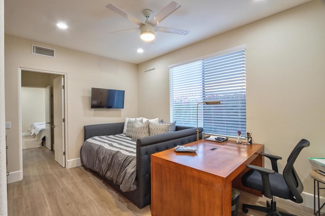 bedroom with light hardwood / wood-style flooring and ceiling fan