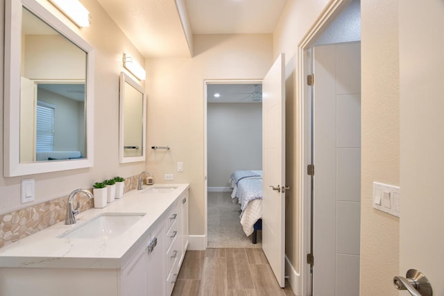 bathroom with vanity and wood-type flooring