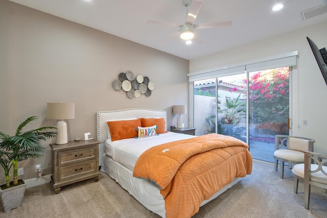 bedroom with access to exterior, light colored carpet, and ceiling fan