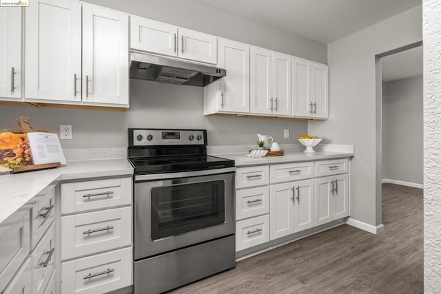 kitchen with white cabinetry, stainless steel range with electric cooktop, and light hardwood / wood-style flooring