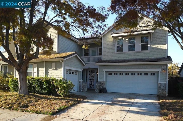 craftsman house with a balcony and a garage