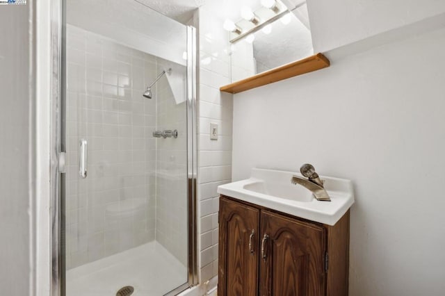 bathroom featuring vanity and walk in shower