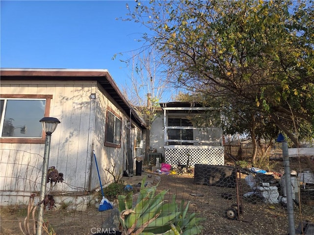 view of side of property with a sunroom