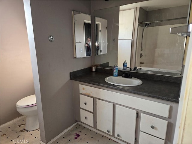 full bathroom with vanity, toilet, and tiled shower / bath