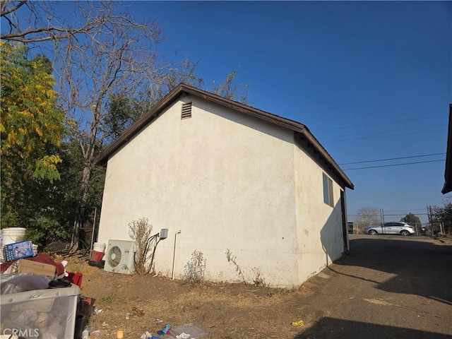 view of home's exterior with ac unit