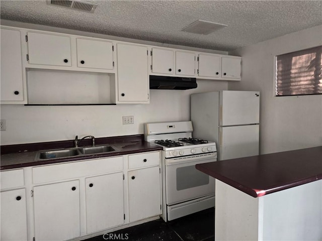 kitchen featuring white cabinetry, white appliances, and sink