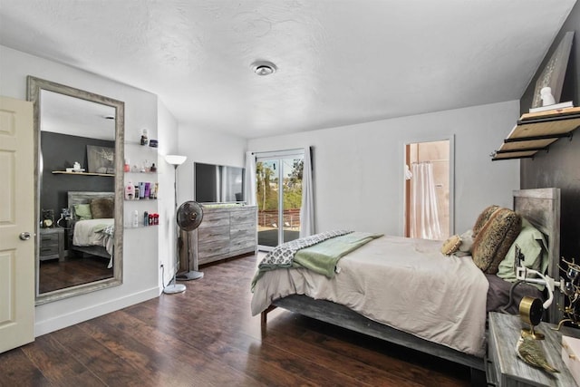 bedroom with access to exterior and dark hardwood / wood-style flooring