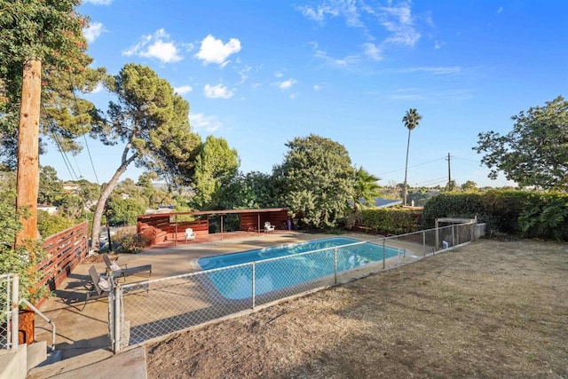 view of swimming pool featuring a patio area