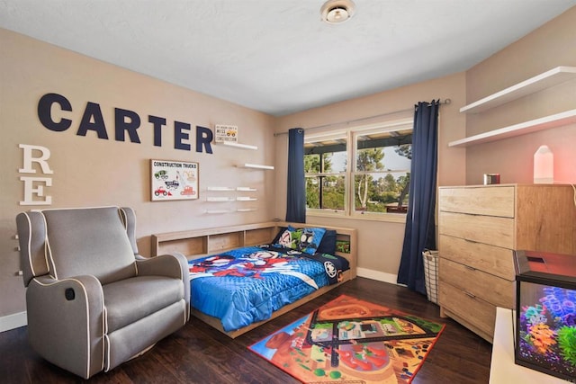 bedroom featuring dark hardwood / wood-style flooring