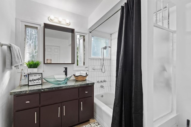 bathroom with vanity and shower / tub combo with curtain