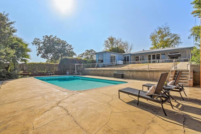 view of swimming pool featuring a patio