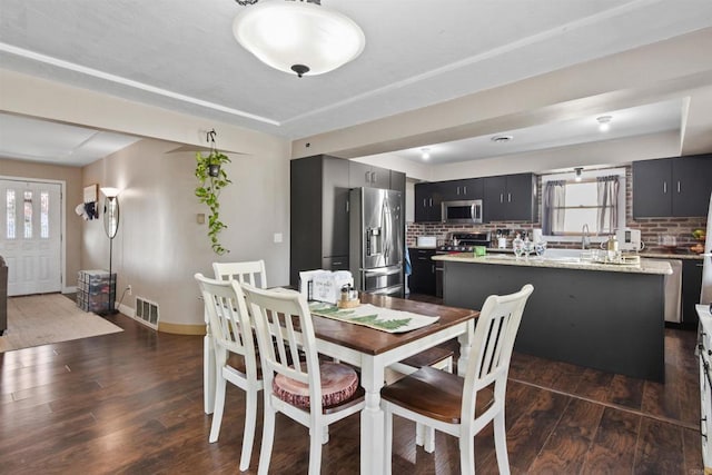 dining space featuring dark hardwood / wood-style floors