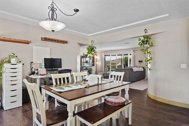 dining area with dark hardwood / wood-style floors