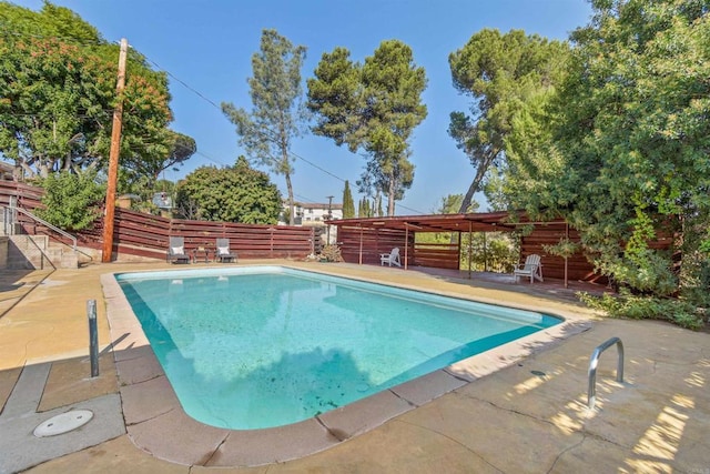 view of pool featuring a patio area