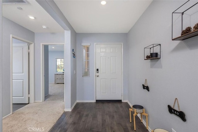 foyer entrance featuring dark wood-type flooring