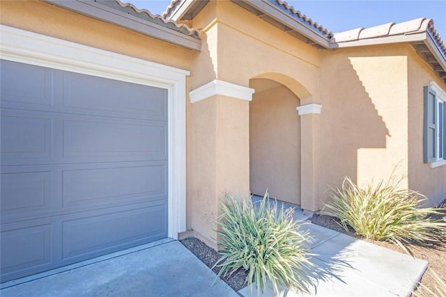 property entrance with a garage