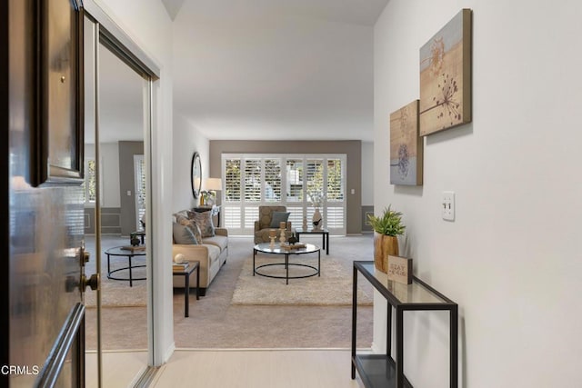 living room with light colored carpet