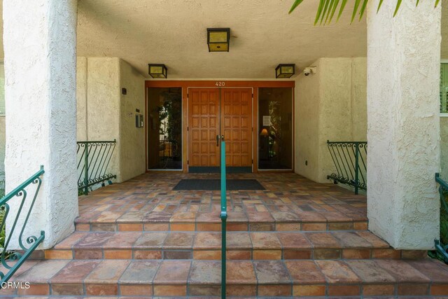 doorway to property featuring a porch