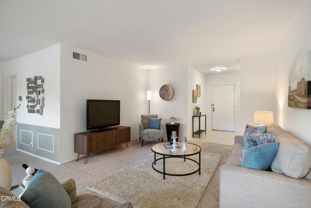 living room featuring light colored carpet