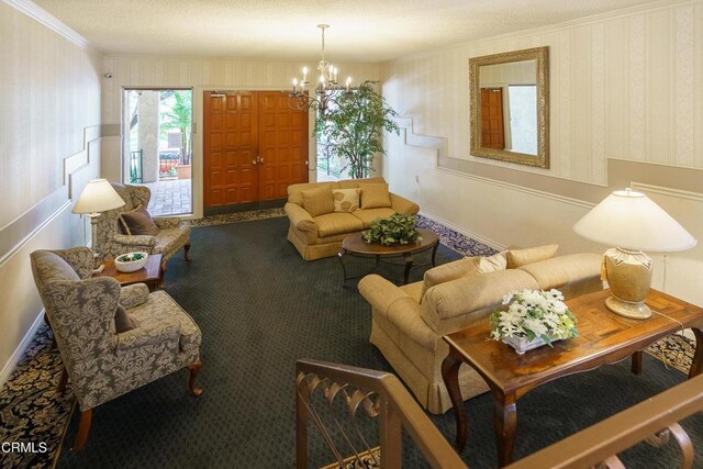 living room featuring a notable chandelier, ornamental molding, and carpet floors