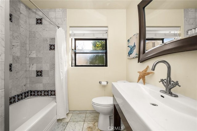 full bathroom with toilet, shower / tub combo with curtain, and sink