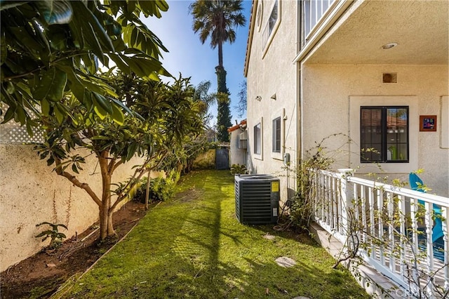 view of yard featuring central air condition unit