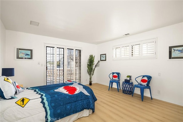 bedroom with light hardwood / wood-style flooring