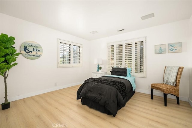 bedroom with light hardwood / wood-style floors