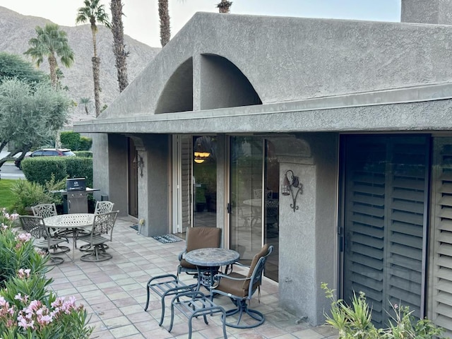 view of patio featuring a grill