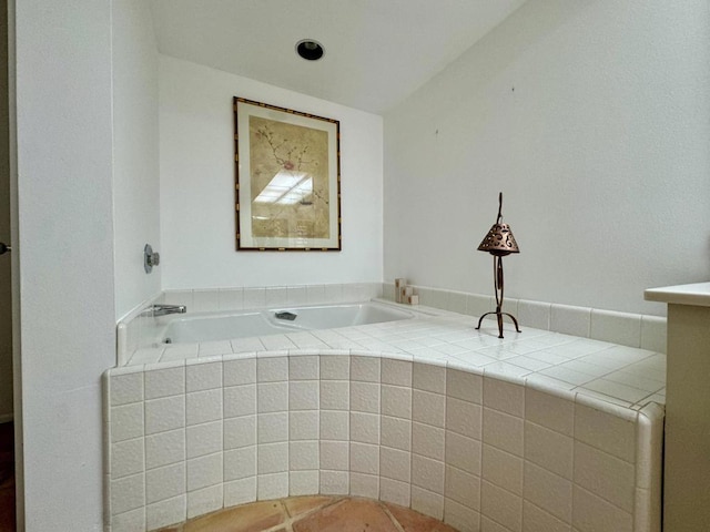 bathroom with tiled bath