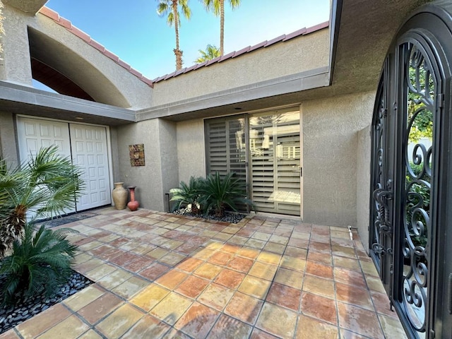 doorway to property featuring a patio area