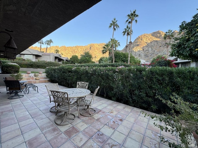 view of patio / terrace with a mountain view