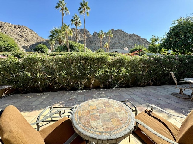 view of patio / terrace featuring a mountain view