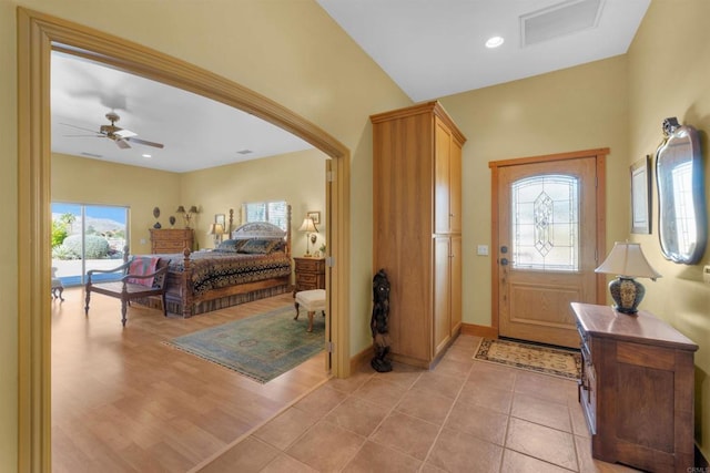 interior space featuring ceiling fan, light hardwood / wood-style flooring, and multiple windows